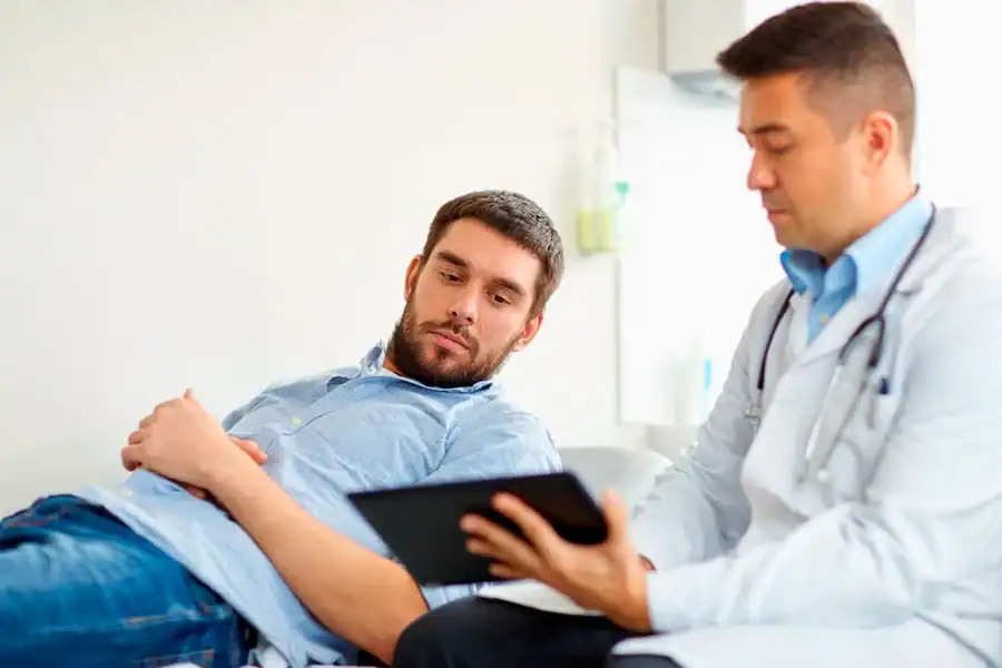 Clinician reviewing information with a patient during an evaluation