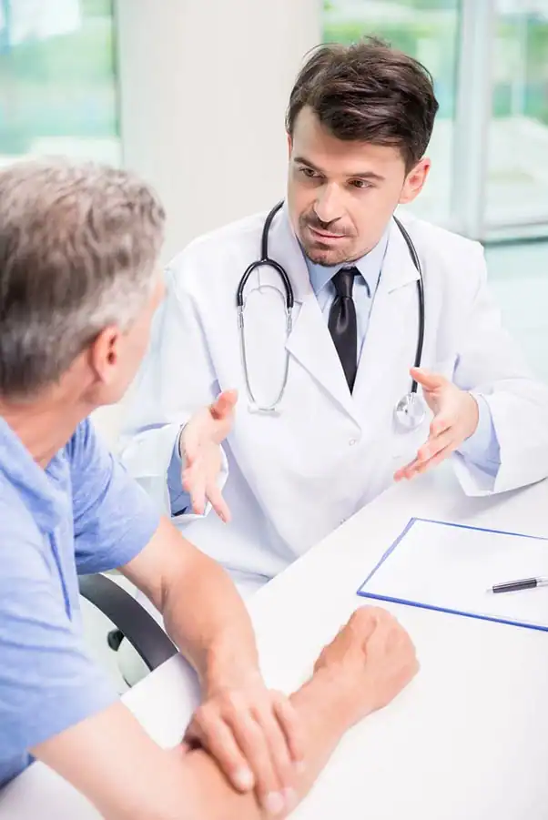 A patient and clinician reviewing a health evaluation