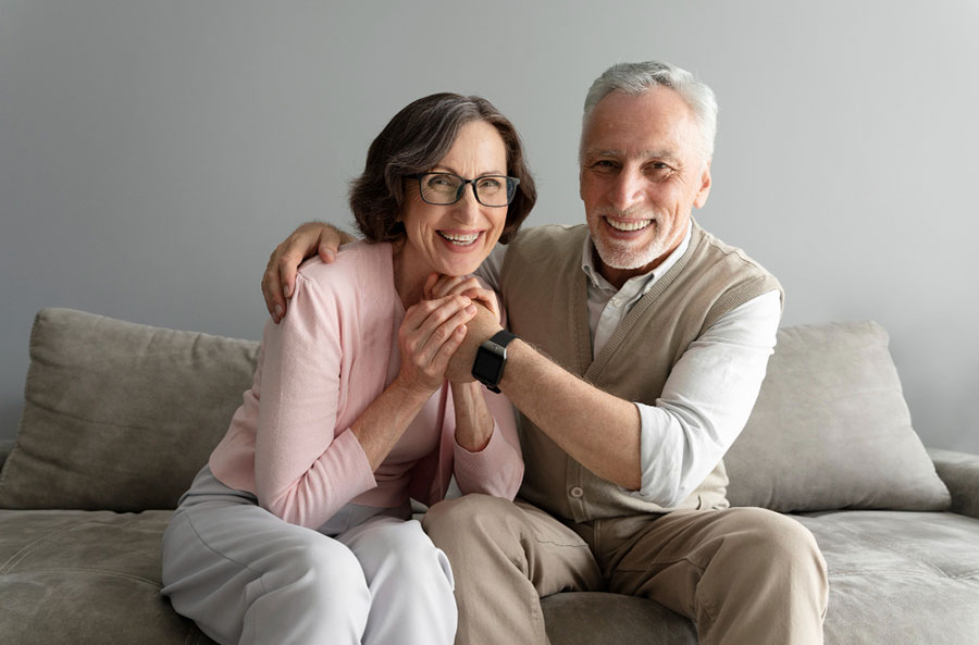A mature couple discussing hormone health with a clinician